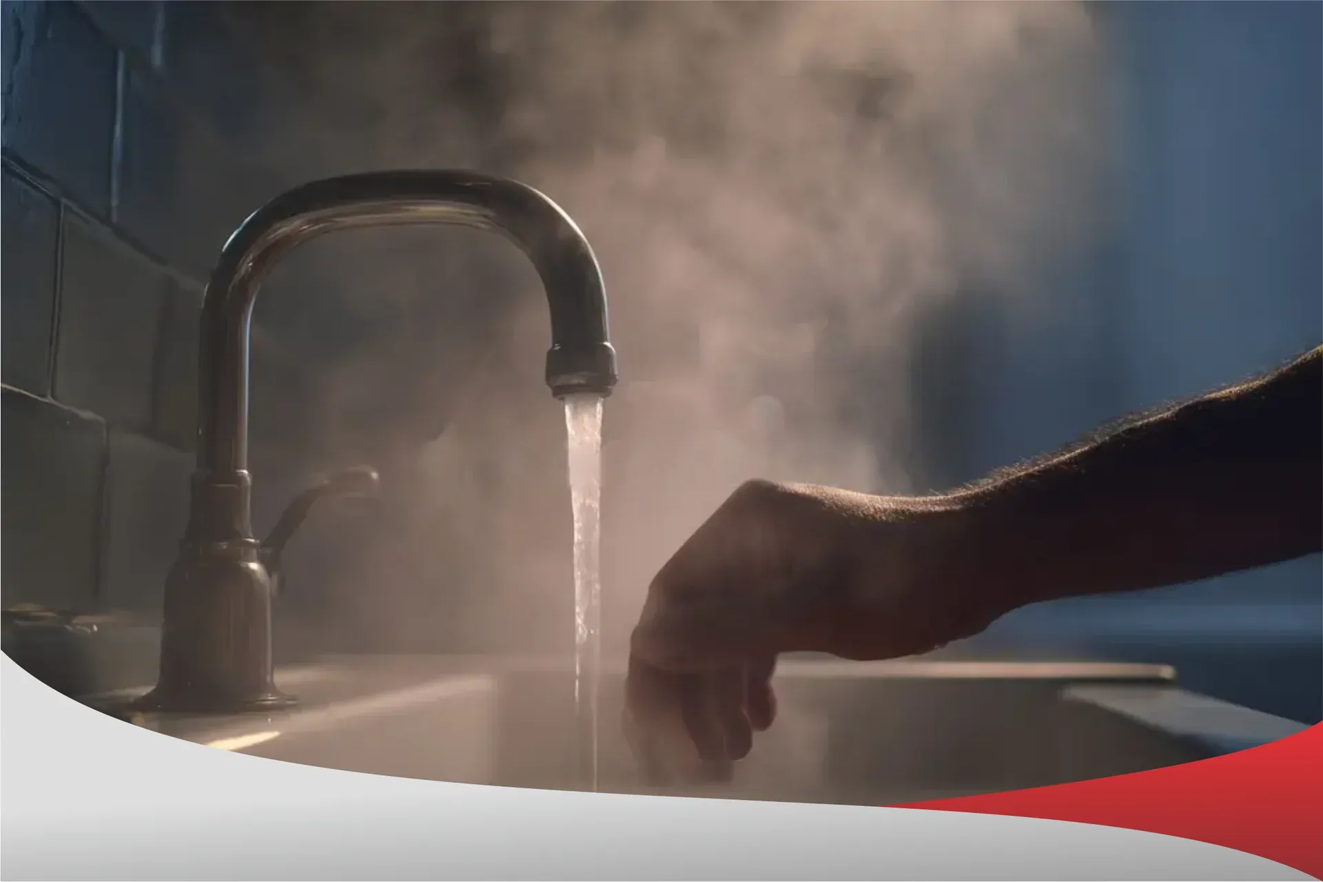 Hand under steaming hot water from a faucet in Chula Vista